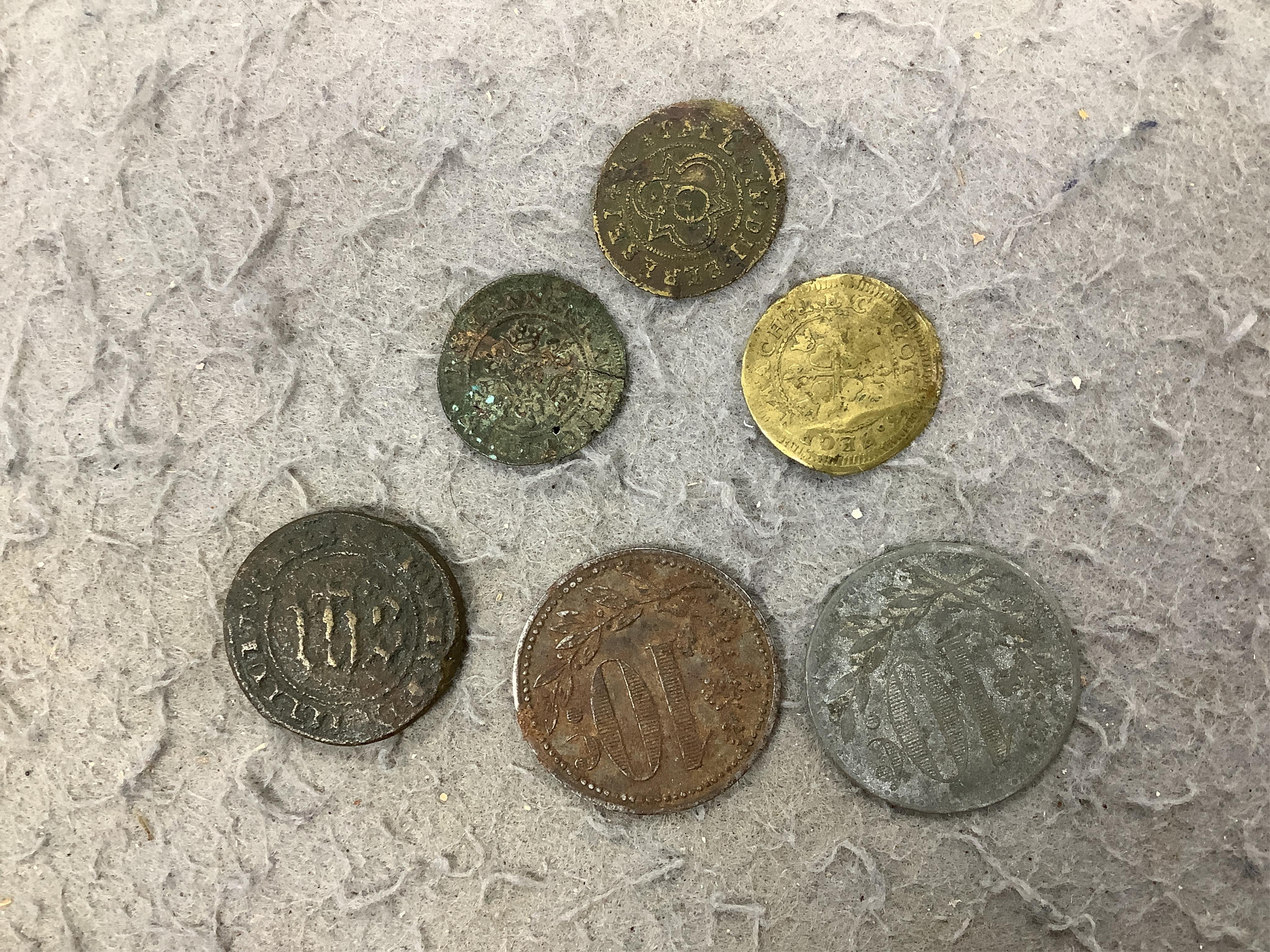 A large collection of halfpenny tokens and gaming tokens, 17th to early 20th century, in an album